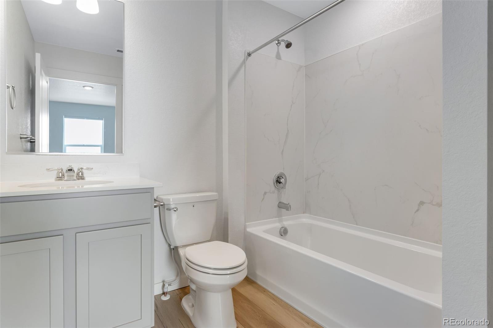 2360 Merlot Street Fort Lupton, CO 80621 - Photo 18 of 21 a bathroom with a sink a toilet and shower
