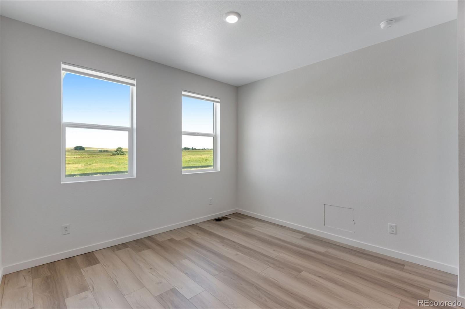 2360 Merlot Street Fort Lupton, CO 80621 - Photo 2 of 21 an empty room with windows