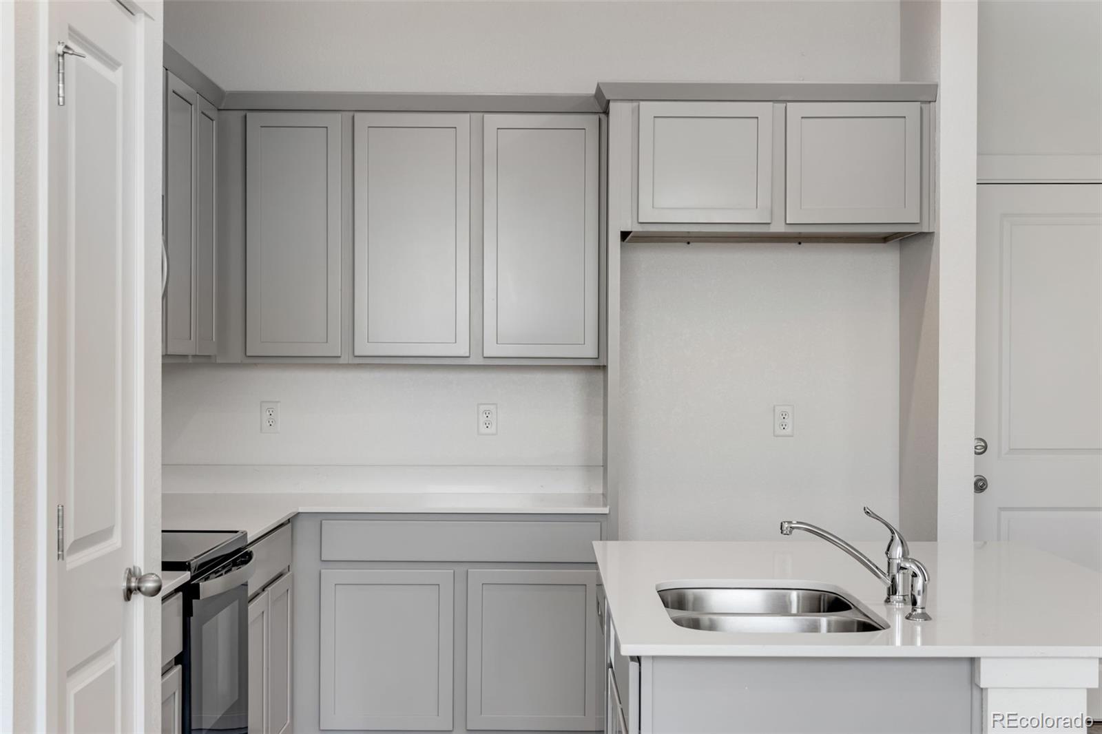 2360 Merlot Street Fort Lupton, CO 80621 - Photo 9 of 21 a bathroom with a sink and cabinets