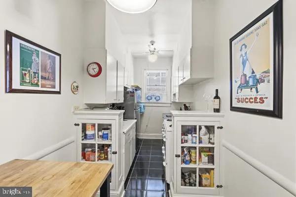 a room with cabinets and window