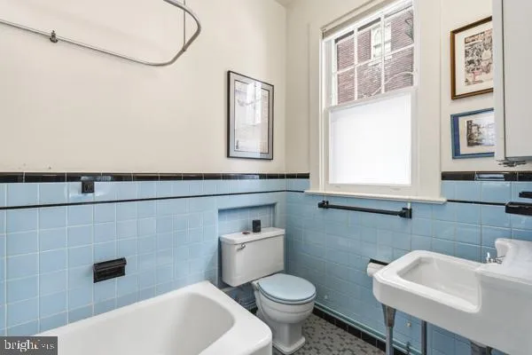 a bathroom with a sink and a toilet