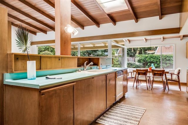 a dining table with chairs in front of it