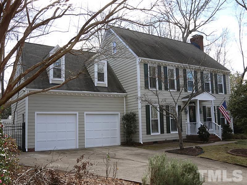 8208 Mourning Dove Road Raleigh, NC 27615 - Photo 1 of 25 a view of a white house with a large tree