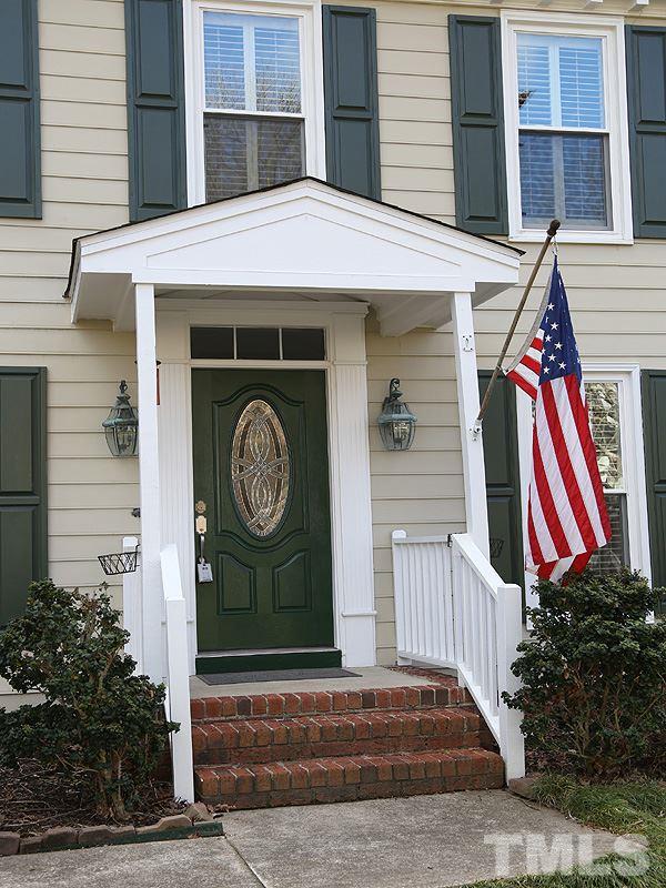 8208 Mourning Dove Road Raleigh, NC 27615 - Photo 2 of 25 a front view of a house with garden