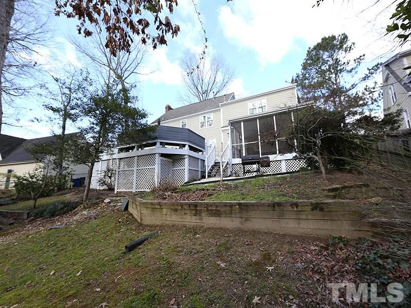 8208 Mourning Dove Road Raleigh, NC 27615 - Photo 24 of 25 a view of a house with a yard