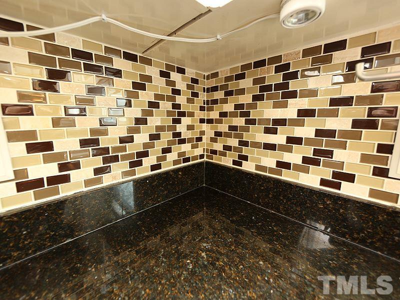8208 Mourning Dove Road Raleigh, NC 27615 - Photo 10 of 25 a bathroom with a black and white checkered floor