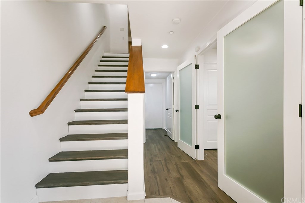 11313 Antonio Stanton, CA 90680 - Photo 1 of 30 Entryway opens to a first floor bedroom, laundry room, garage, and stairway.