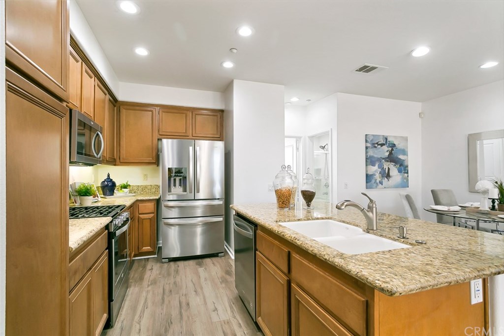 11313 Antonio Stanton, CA 90680 - Photo 13 of 30 Granite countertops, stainless steel appliances, and large kitchen island!