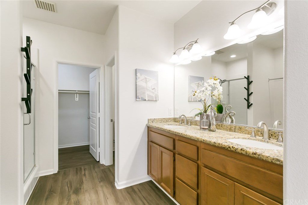 11313 Antonio Stanton, CA 90680 - Photo 24 of 30 Large en-suite bathroom with granite counters, upgraded lighting, and a large walk-in closet
