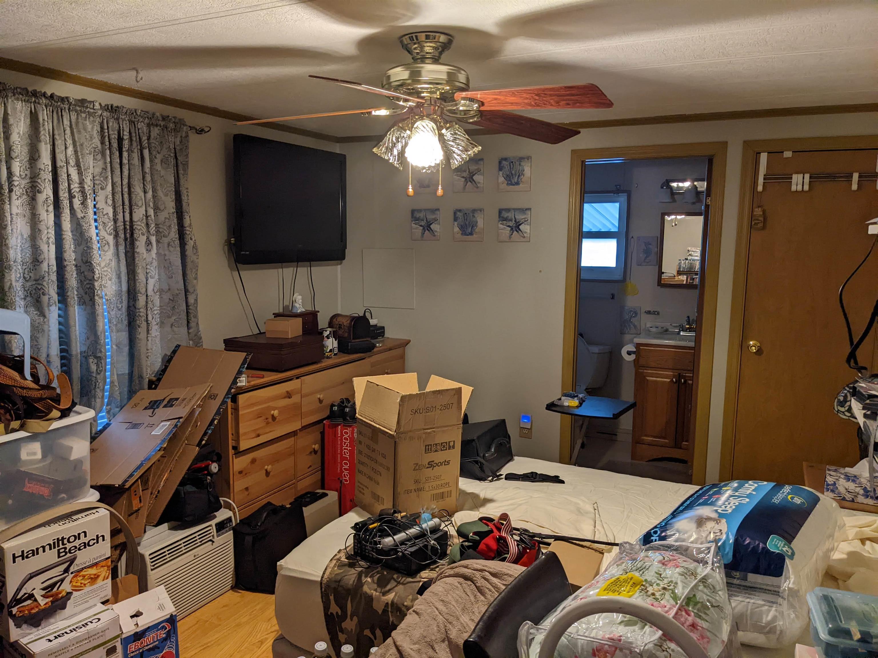 577 Miles Standish Lane Buena, NJ 08310 - Photo 11 of 11 a bedroom with a bed and a flat screen tv