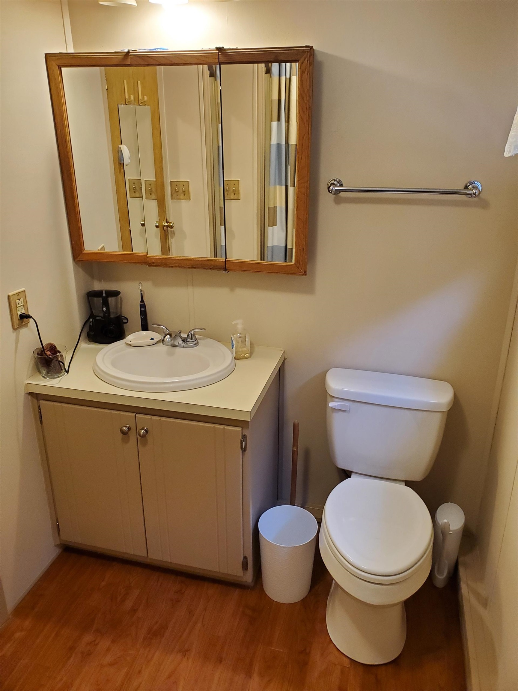 577 Miles Standish Lane Buena, NJ 08310 - Photo 5 of 11 a bathroom with a toilet sink and mirror