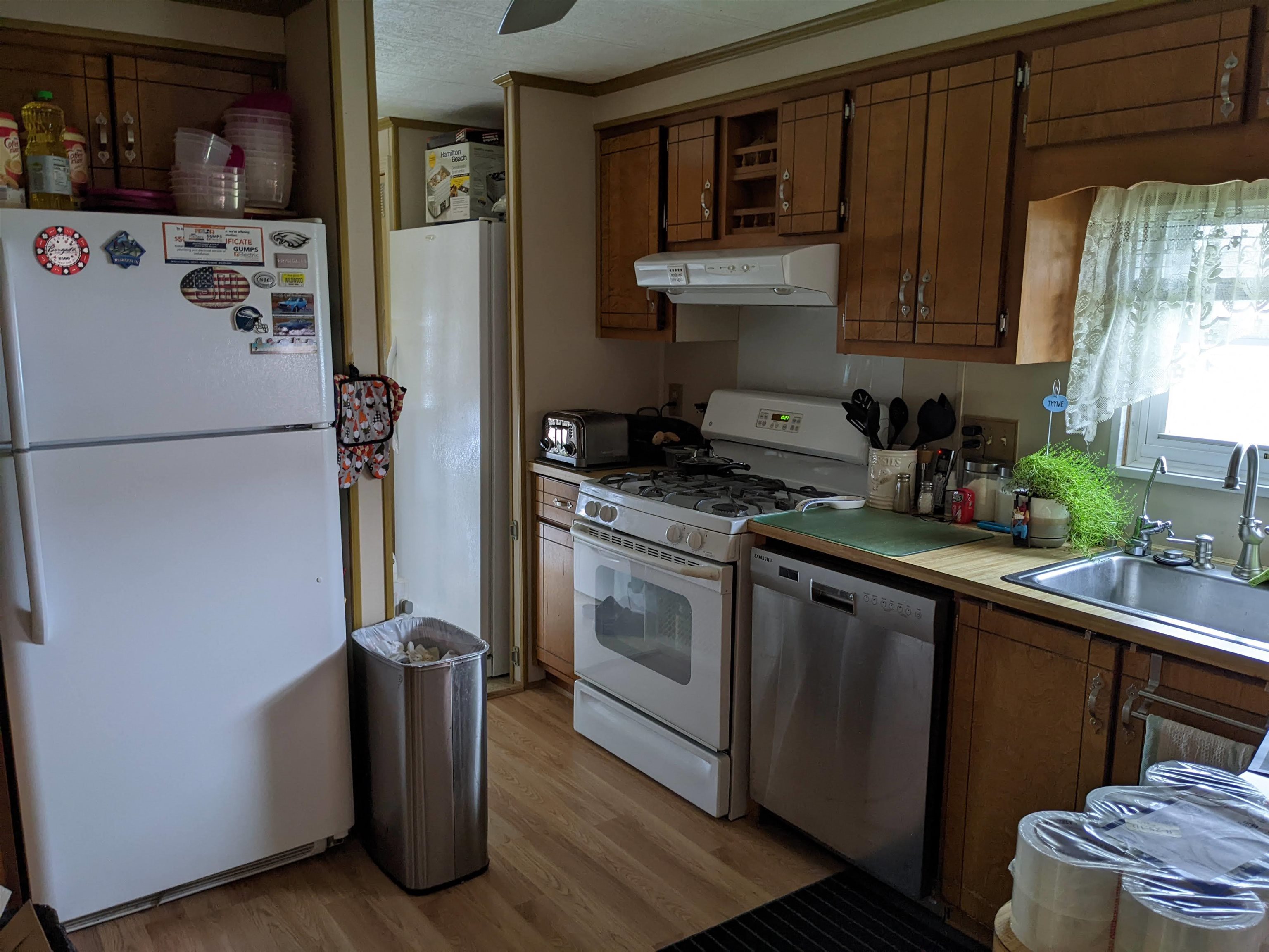 577 Miles Standish Lane Buena, NJ 08310 - Photo 8 of 11 a kitchen with stainless steel appliances granite countertop a refrigerator stove and sink