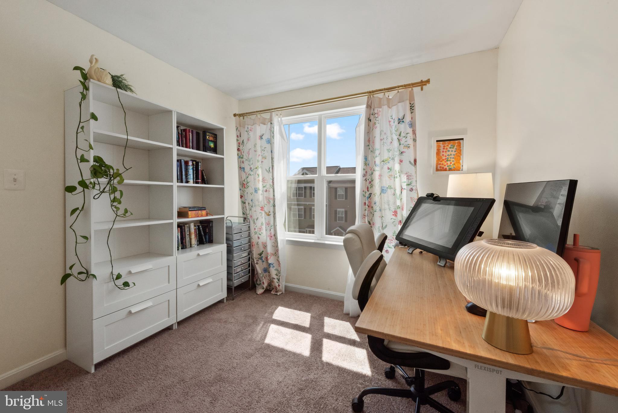 61 Grant Street Taneytown, MD 21787 - Photo 21 of 34 a room with furniture and a book shelf
