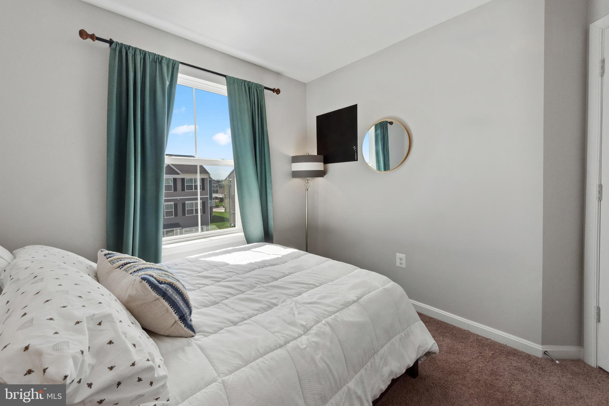 61 Grant Street Taneytown, MD 21787 - Photo 23 of 34 a bedroom with a bed and sliding door