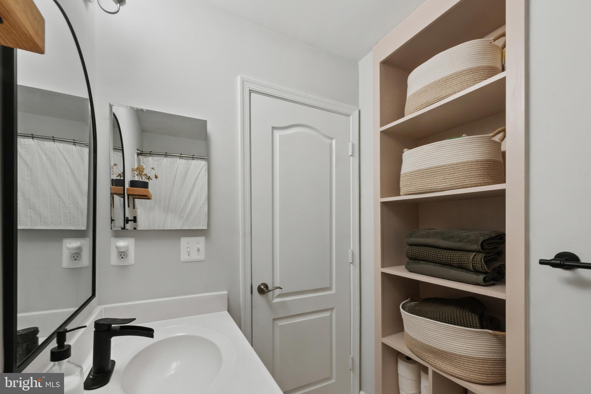 61 Grant Street Taneytown, MD 21787 - Photo 25 of 34 a bathroom with a sink and a mirror
