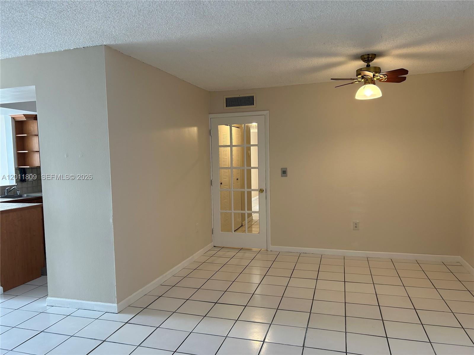 9411 Southwest 4th Street, Unit 202 Miami, FL 33174 - Photo 1 of 20 a view of an empty room and window