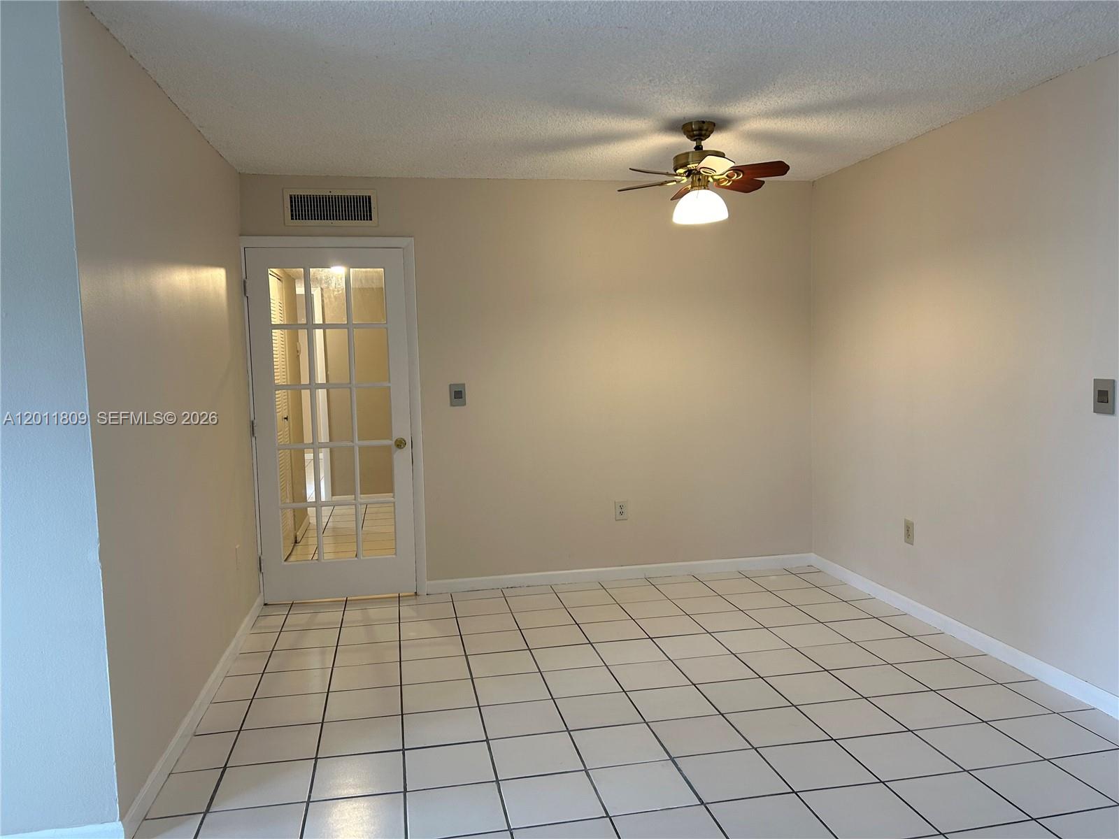 9411 Southwest 4th Street, Unit 202 Miami, FL 33174 - Photo 5 of 20 a view of an empty room and window