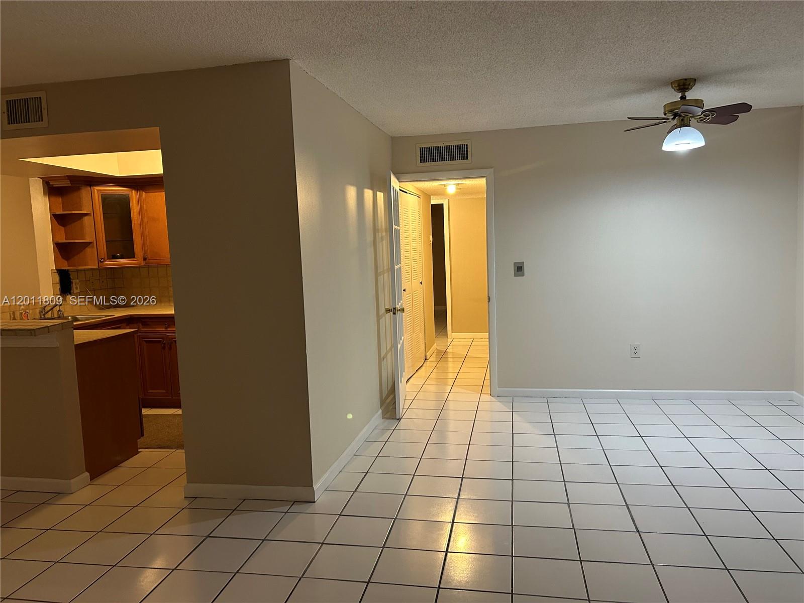 9411 Southwest 4th Street, Unit 202 Miami, FL 33174 - Photo 9 of 20 a view of a livingroom with a chandelier