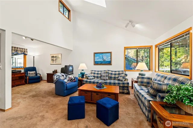 a living room with furniture large window and outer view