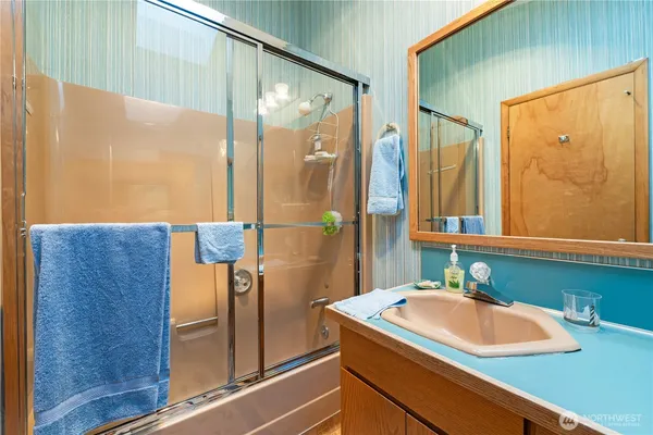 a bathroom with a sink and a mirror