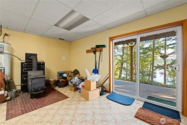 a bedroom with furniture and a large window