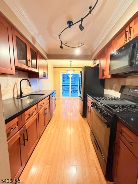 41 Manor Drive Princeton, NJ 08540 - Photo 8 of 21 a kitchen with stainless steel appliances granite countertop a sink and a stove
