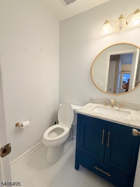 41 Manor Drive Princeton, NJ 08540 - Photo 10 of 21 a bathroom with a toilet sink and mirror