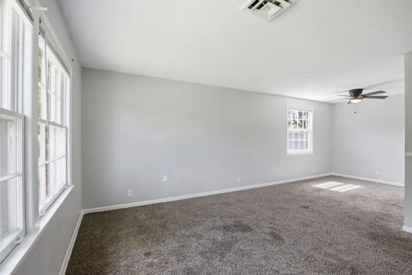 an empty room with windows