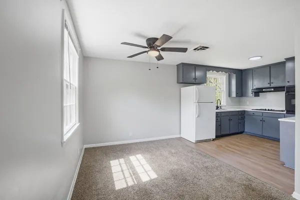 a kitchen with a refrigerator a sink and dishwasher
