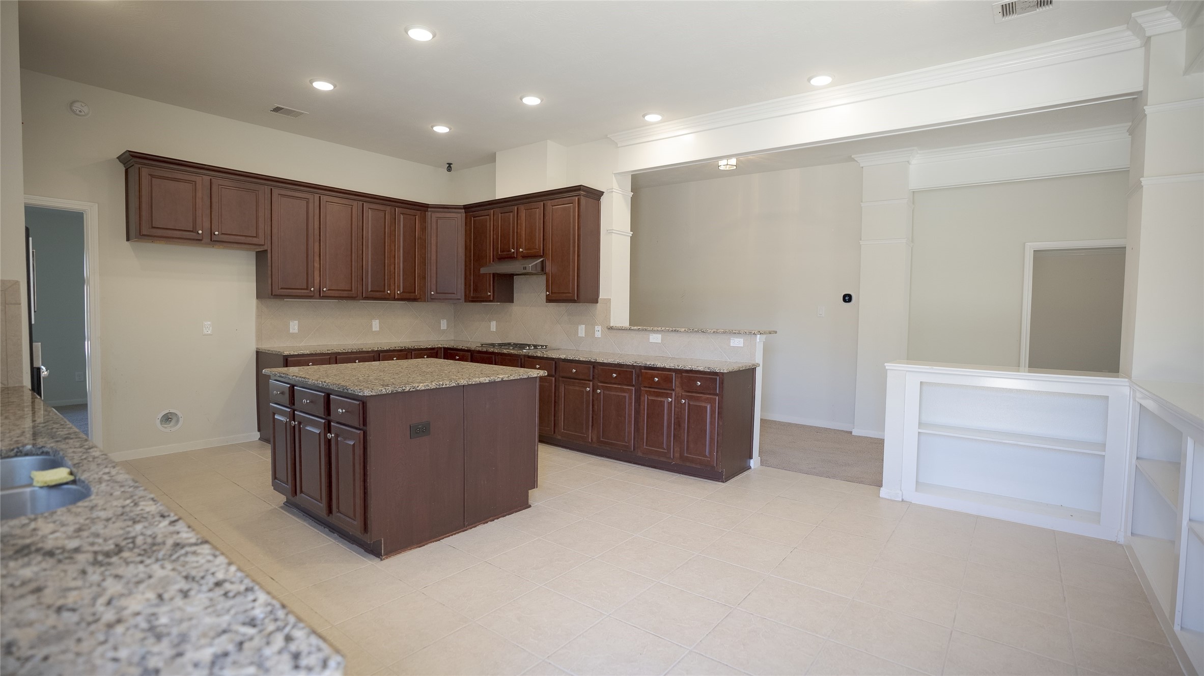 38 Palmero Way Manvel, TX 77578 - Photo 19 of 39 a kitchen with stainless steel appliances granite countertop a stove a sink and a refrigerator