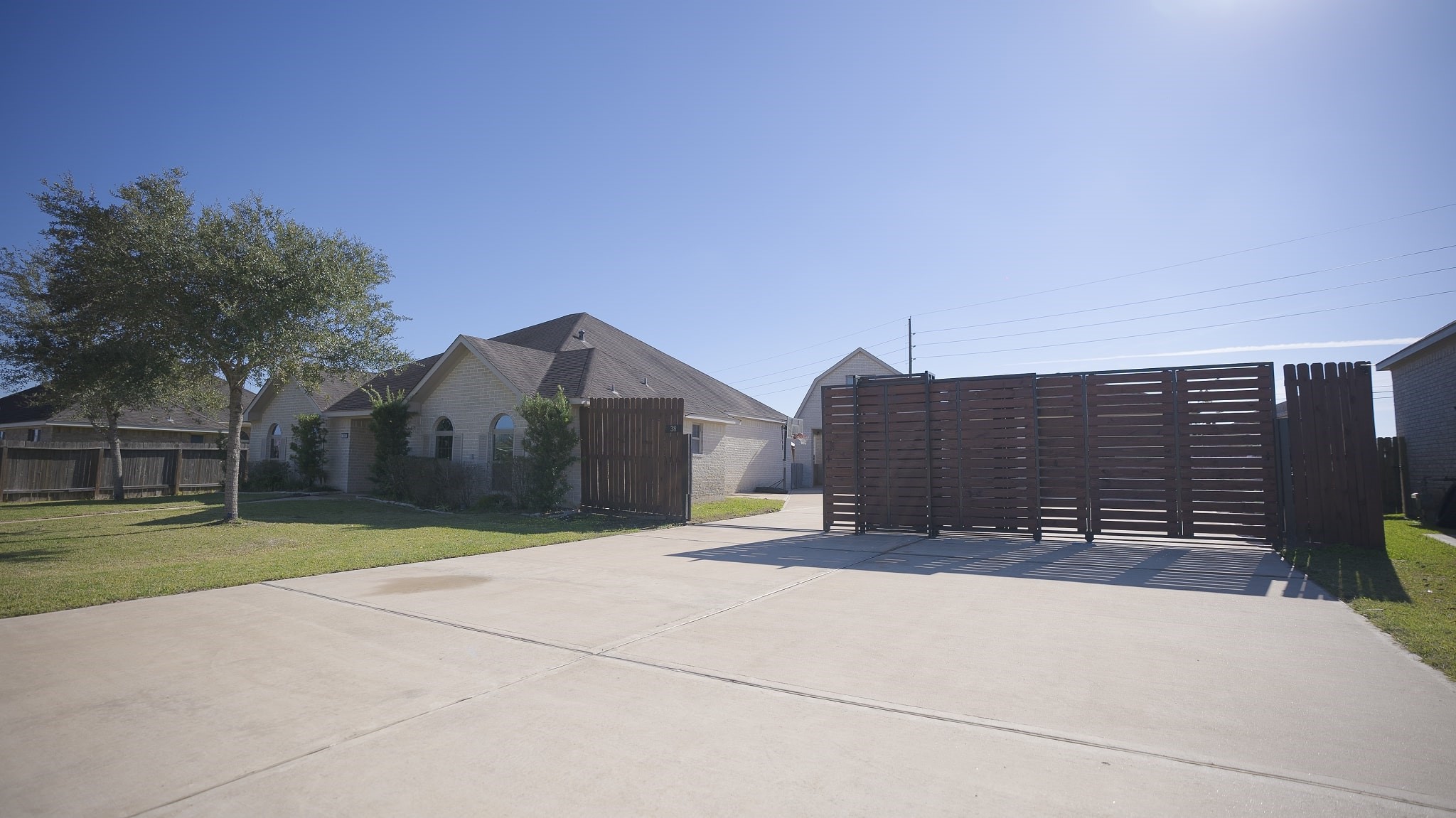 38 Palmero Way Manvel, TX 77578 - Photo 9 of 39 a view of a house with a yard and a large parking space
