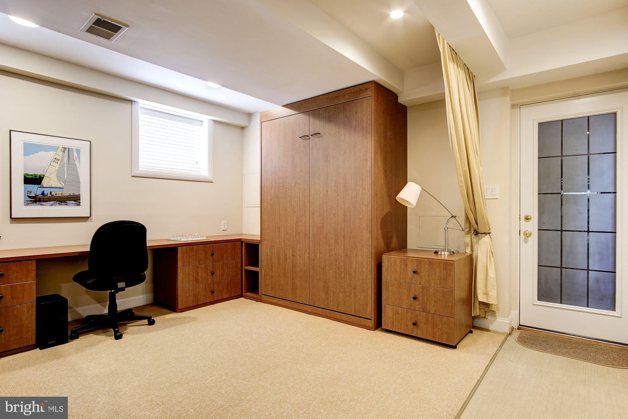 3323 Reservoir Road Northwest Washington, DC 20007 - Photo 29 of 37 Lower Level Family Room w/Murphy Bed