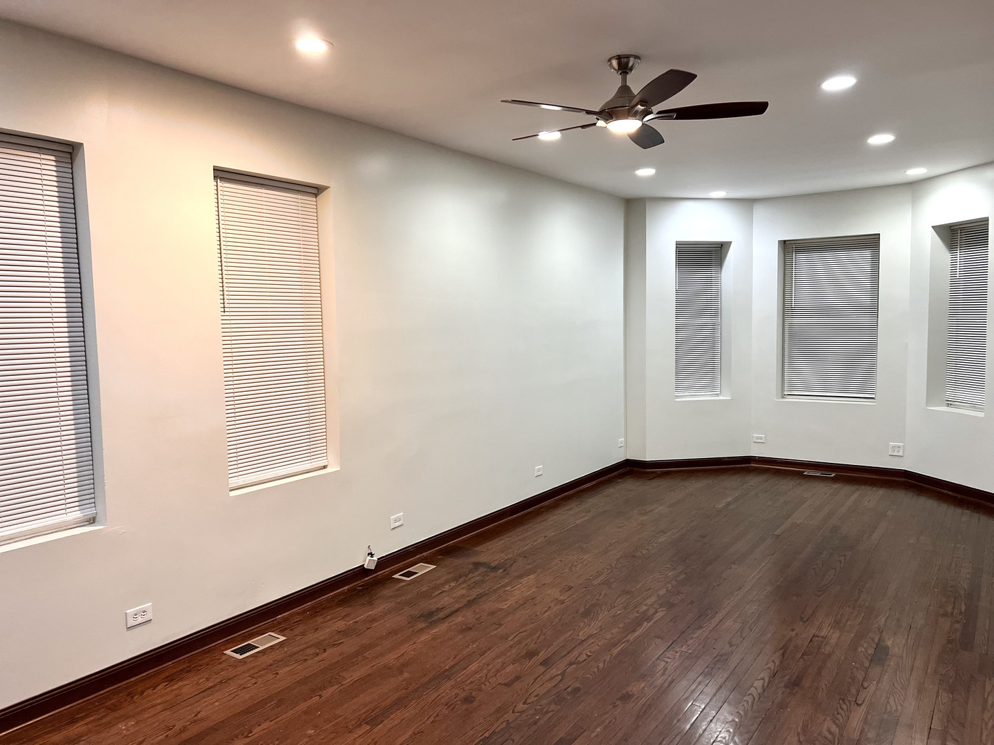4116 West Cermak Road, Unit 2 Chicago, IL 60623 - Photo 3 of 10 wooden floor in an empty room with a window