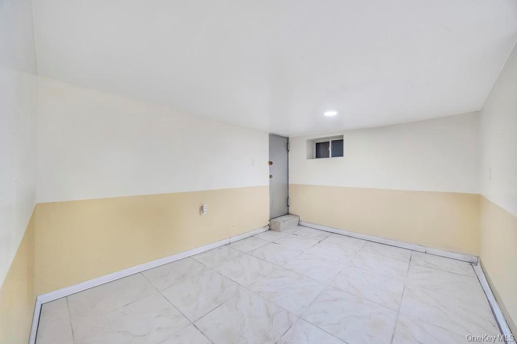 95-26 86th Street Queens, NY 11416 - Photo 27 of 28 Empty room with baseboards
