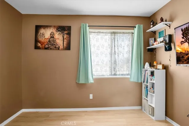 a front view of a house with basket ball court