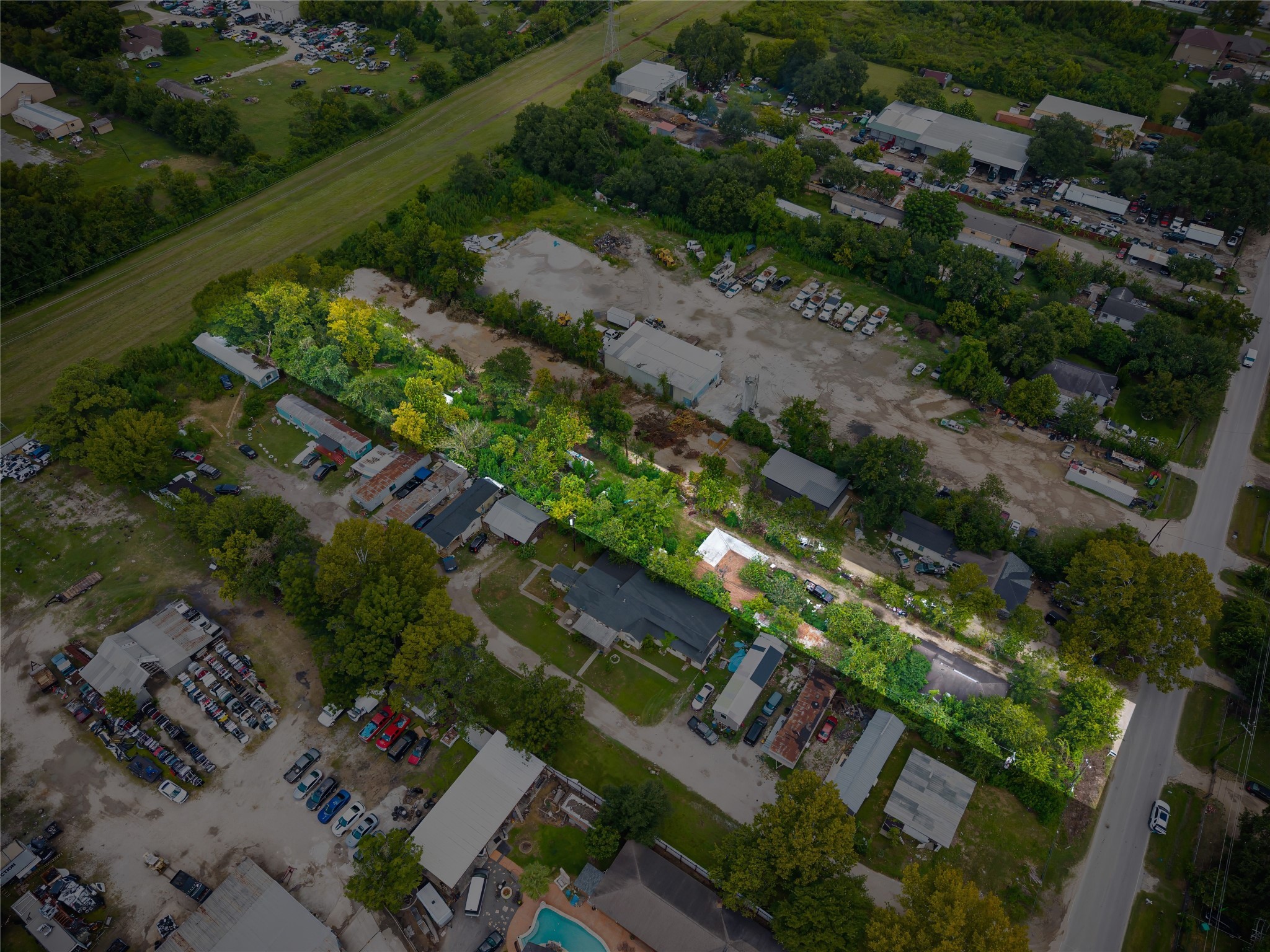 an aerial view of a houses with yard