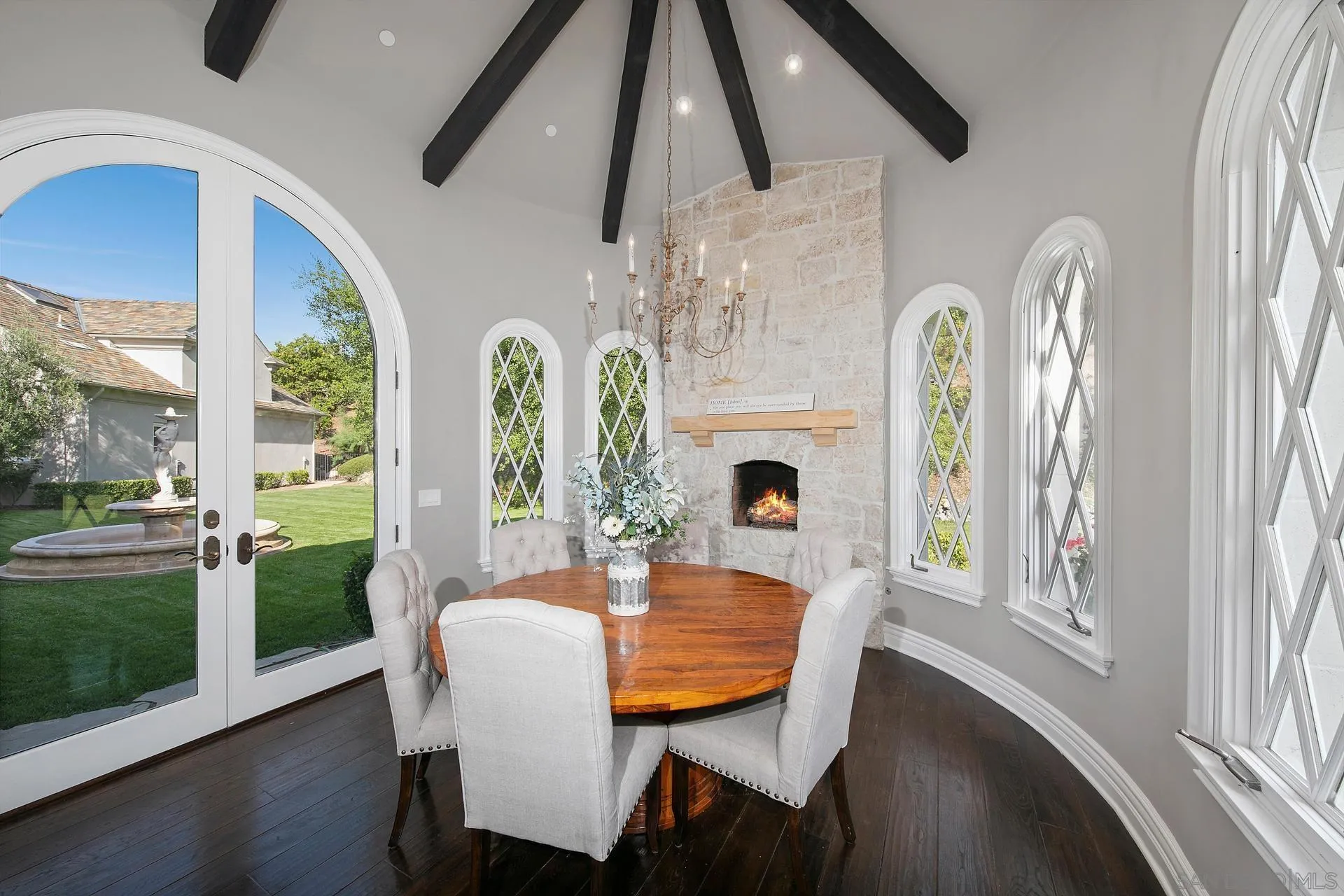 18781 Heritage Drive Poway, CA 92064 - Photo 19 of 69 a dining room with furniture a fireplace and wooden floor