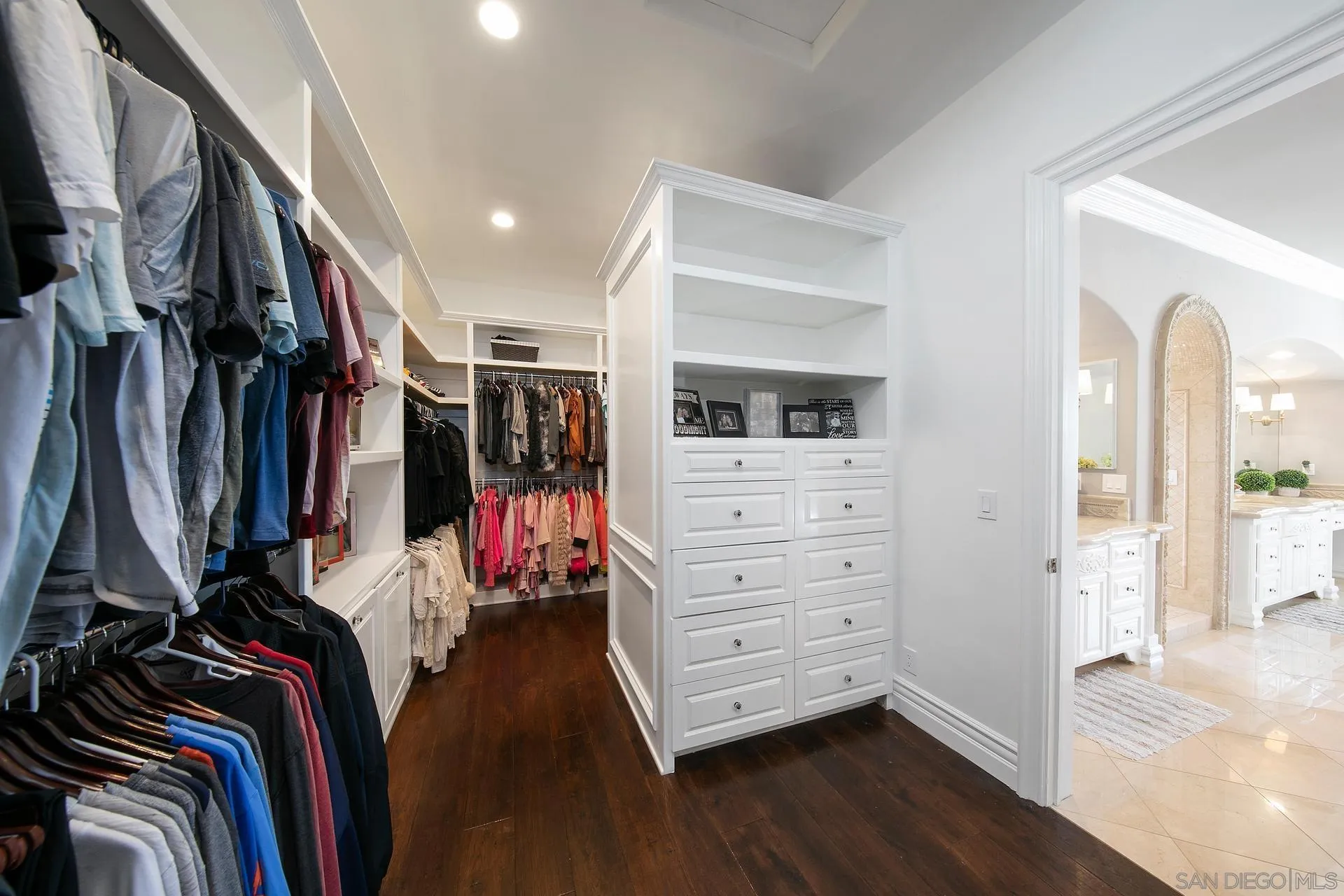 18781 Heritage Drive Poway, CA 92064 - Photo 32 of 69 a view of walk in closet with clothes and shoes