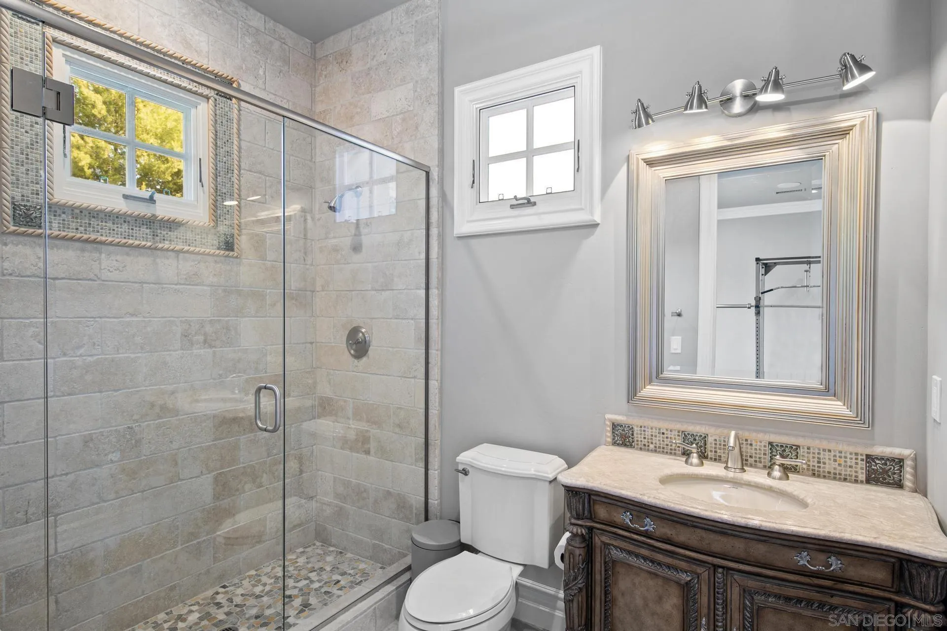 18781 Heritage Drive Poway, CA 92064 - Photo 41 of 69 a bathroom with a sink a toilet and shower