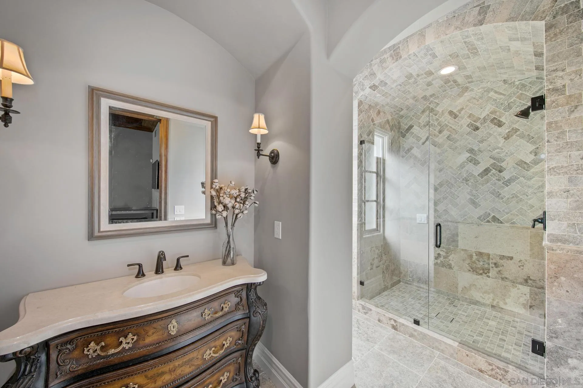 18781 Heritage Drive Poway, CA 92064 - Photo 44 of 69 a bathroom with a sink and a mirror