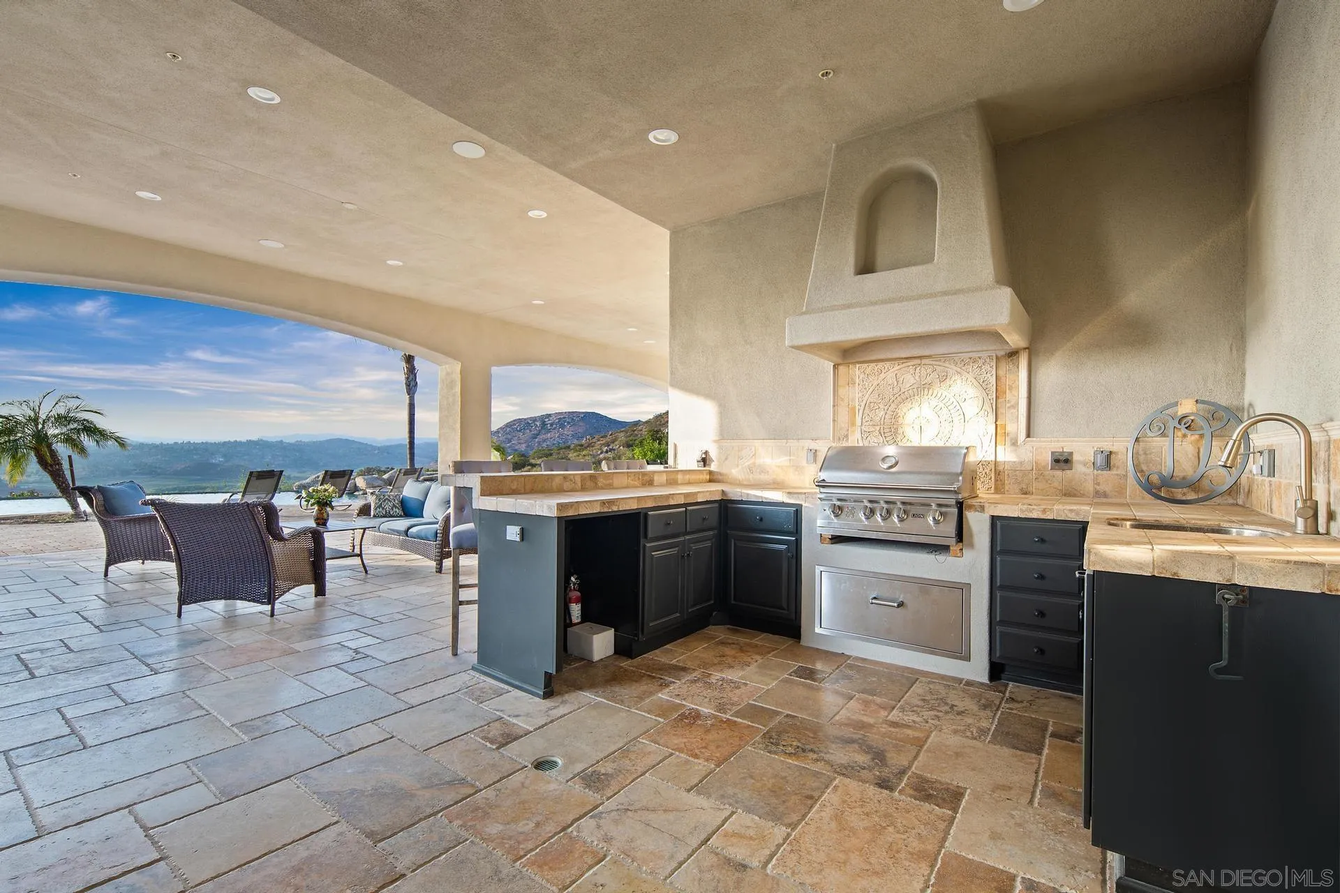 18781 Heritage Drive Poway, CA 92064 - Photo 49 of 69 a kitchen with a sink a counter top space and stainless steel appliances