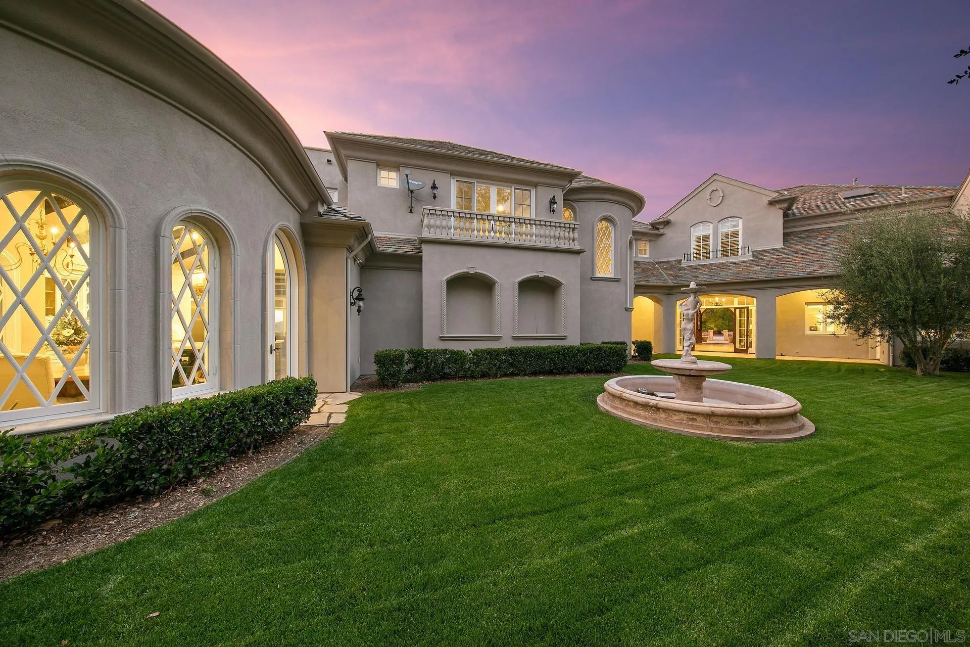 18781 Heritage Drive Poway, CA 92064 - Photo 55 of 69 a front view of a house with a yard and garage