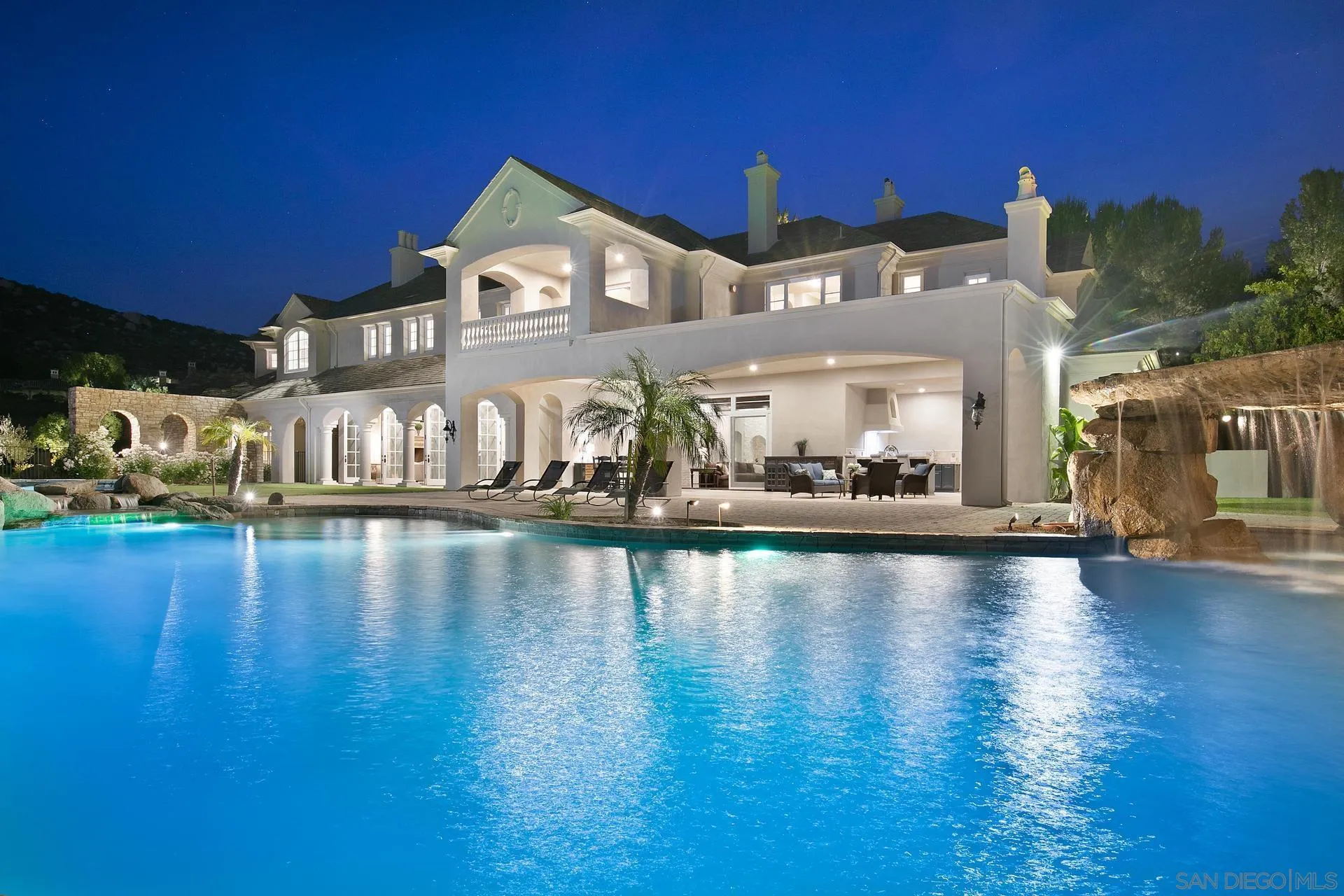 18781 Heritage Drive Poway, CA 92064 - Photo 67 of 69 a view of a building with river water fountain and large windows