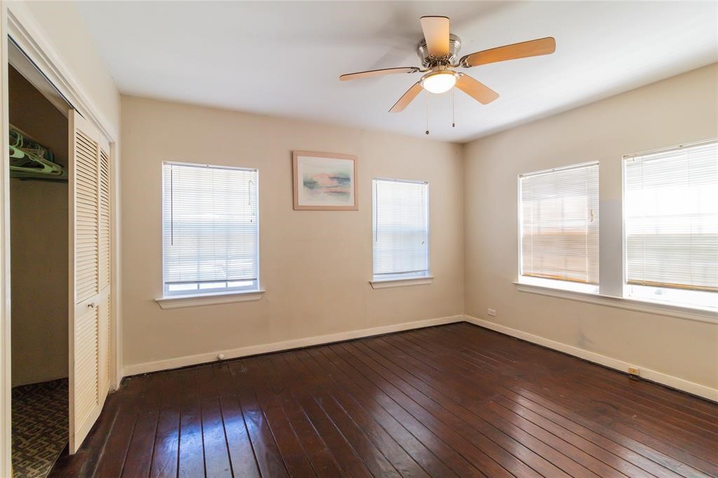 1961 Dryden Road Houston, TX 77030 - Photo 12 of 33 a view of an empty room with wooden floor and a window
