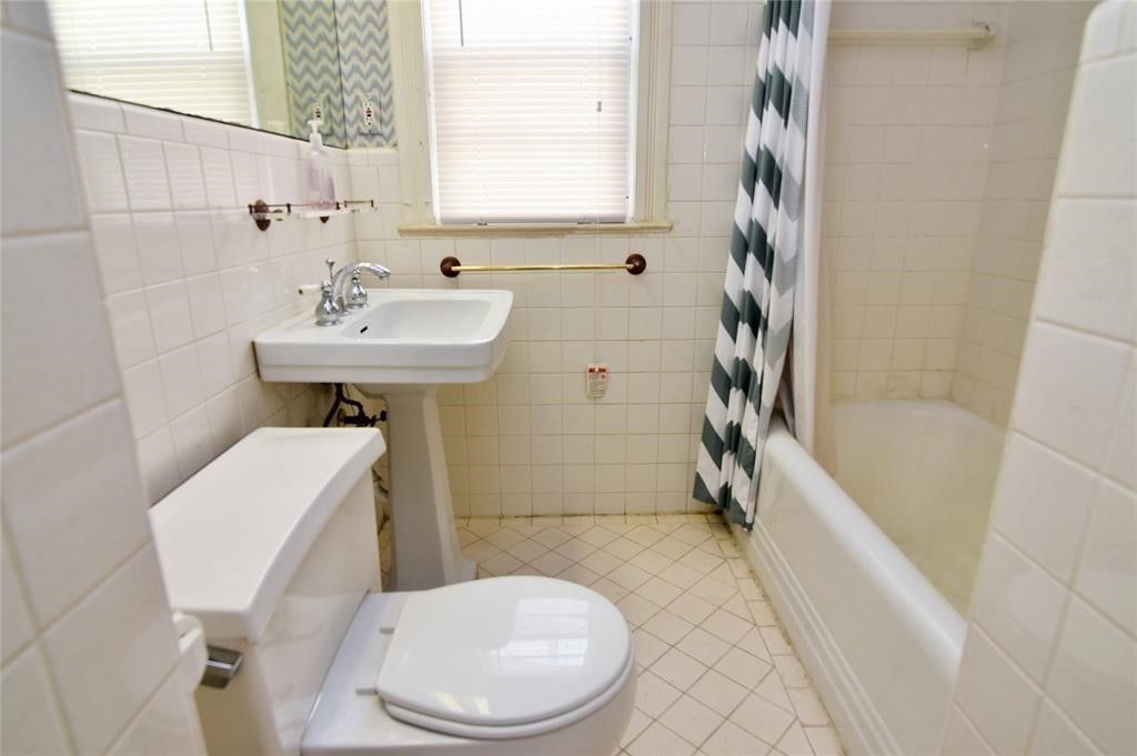 1961 Dryden Road Houston, TX 77030 - Photo 20 of 33 a bathroom with a sink toilet and shower