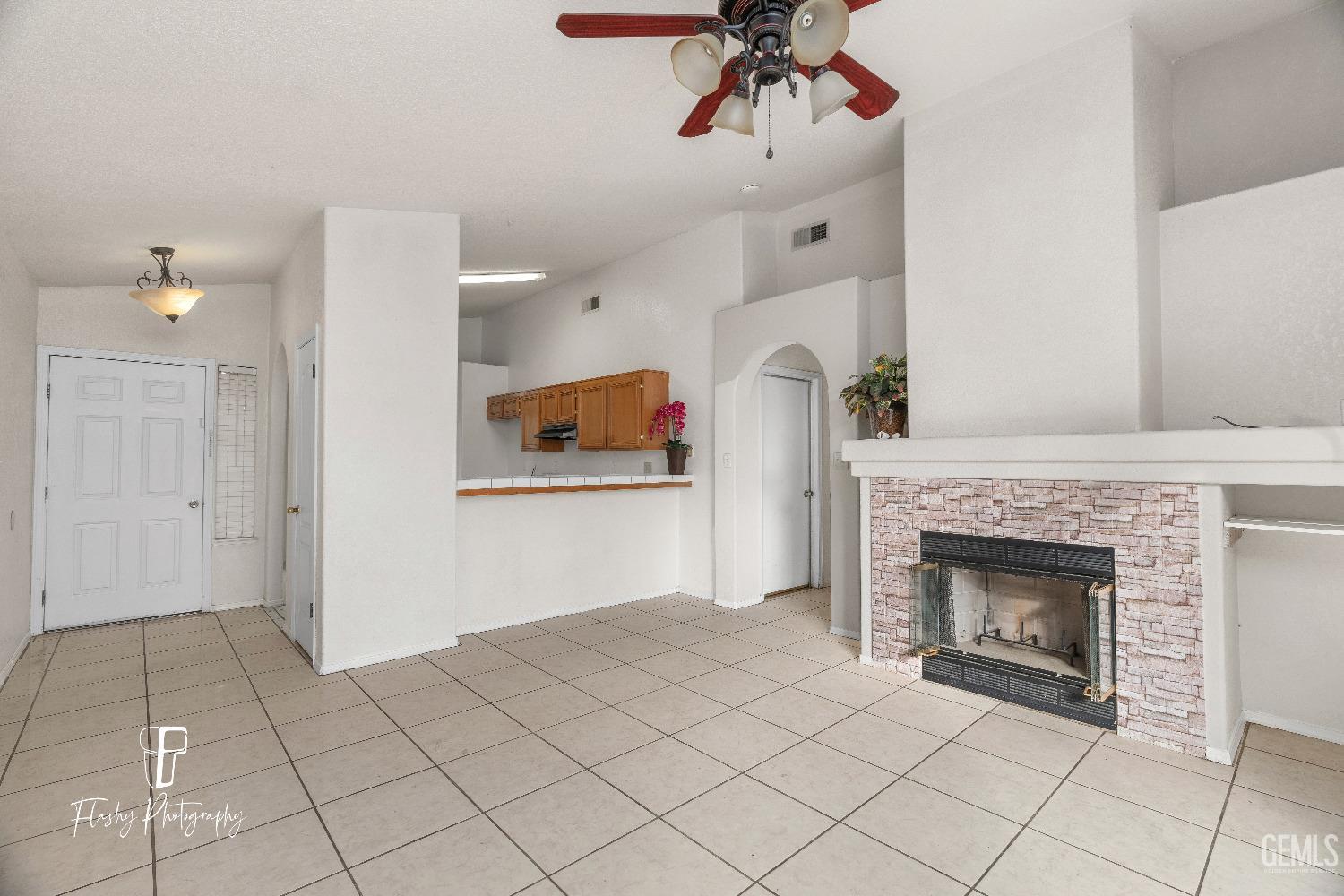 Undisclosed Address Bakersfield, CA 93313 - Photo 11 of 27 a view of an empty room and fire place