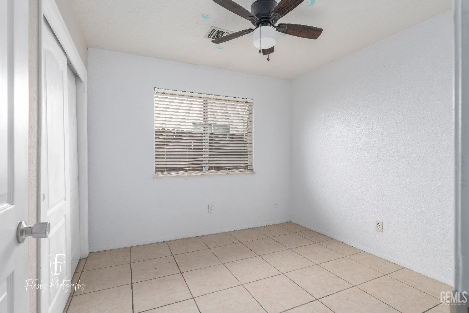 Undisclosed Address Bakersfield, CA 93313 - Photo 13 of 27 a view of an empty room with a window