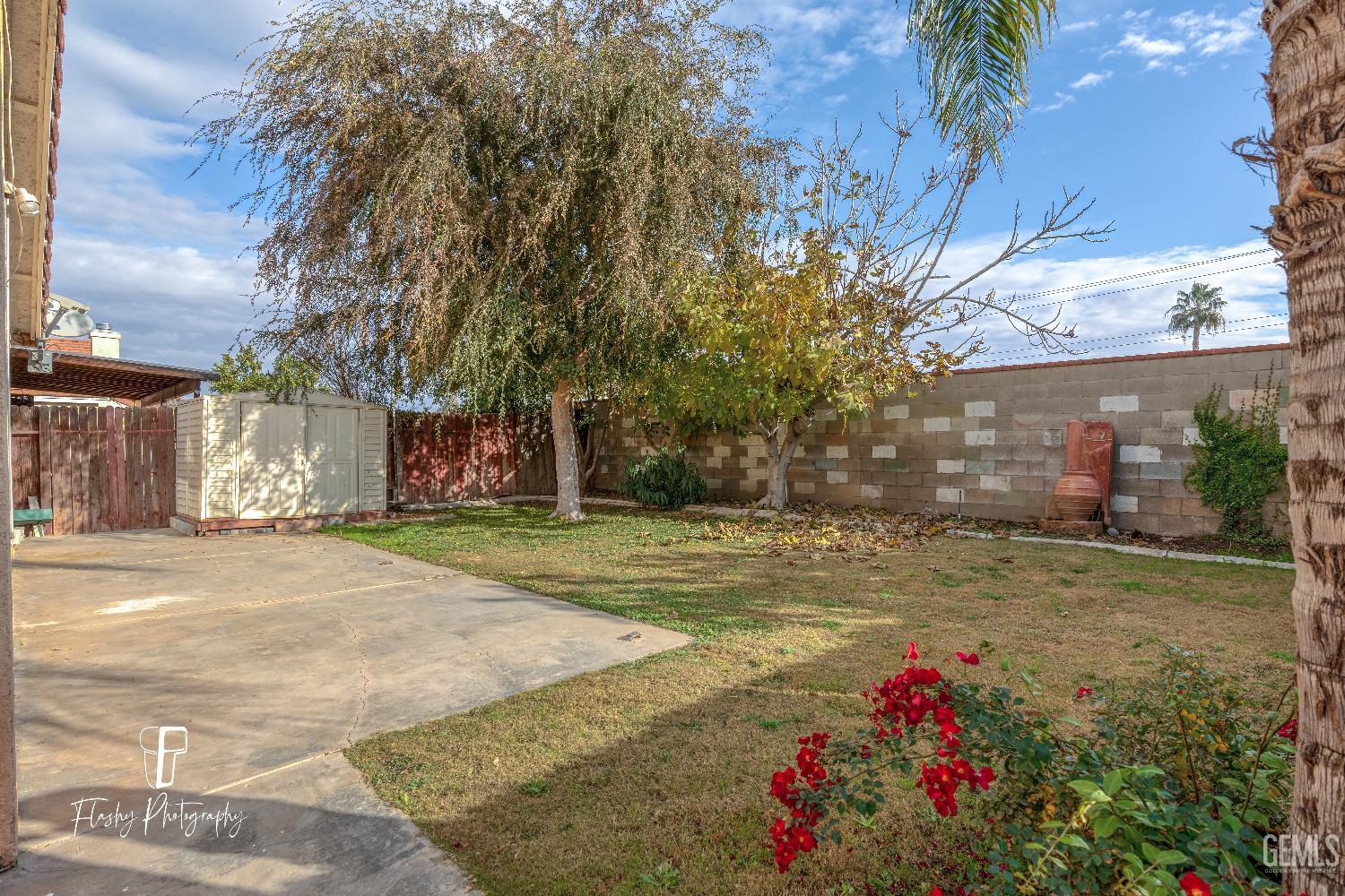 Undisclosed Address Bakersfield, CA 93313 - Photo 25 of 27 a front view of a house with a yard