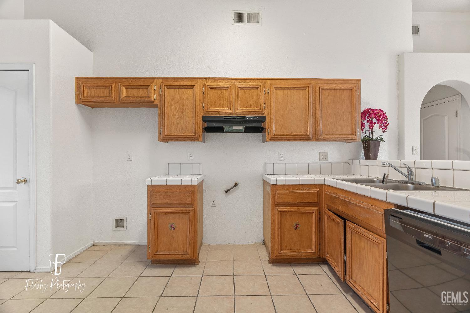 Undisclosed Address Bakersfield, CA 93313 - Photo 6 of 27 a kitchen with a sink and cabinets