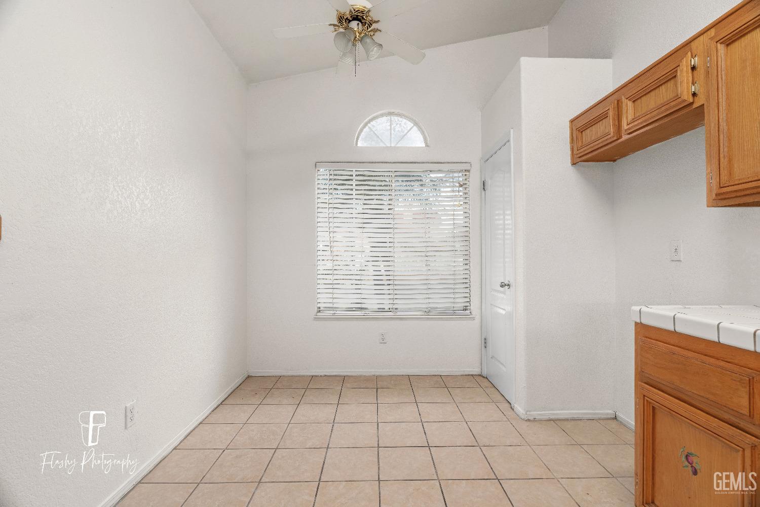 Undisclosed Address Bakersfield, CA 93313 - Photo 7 of 27 a view of an empty room with a window